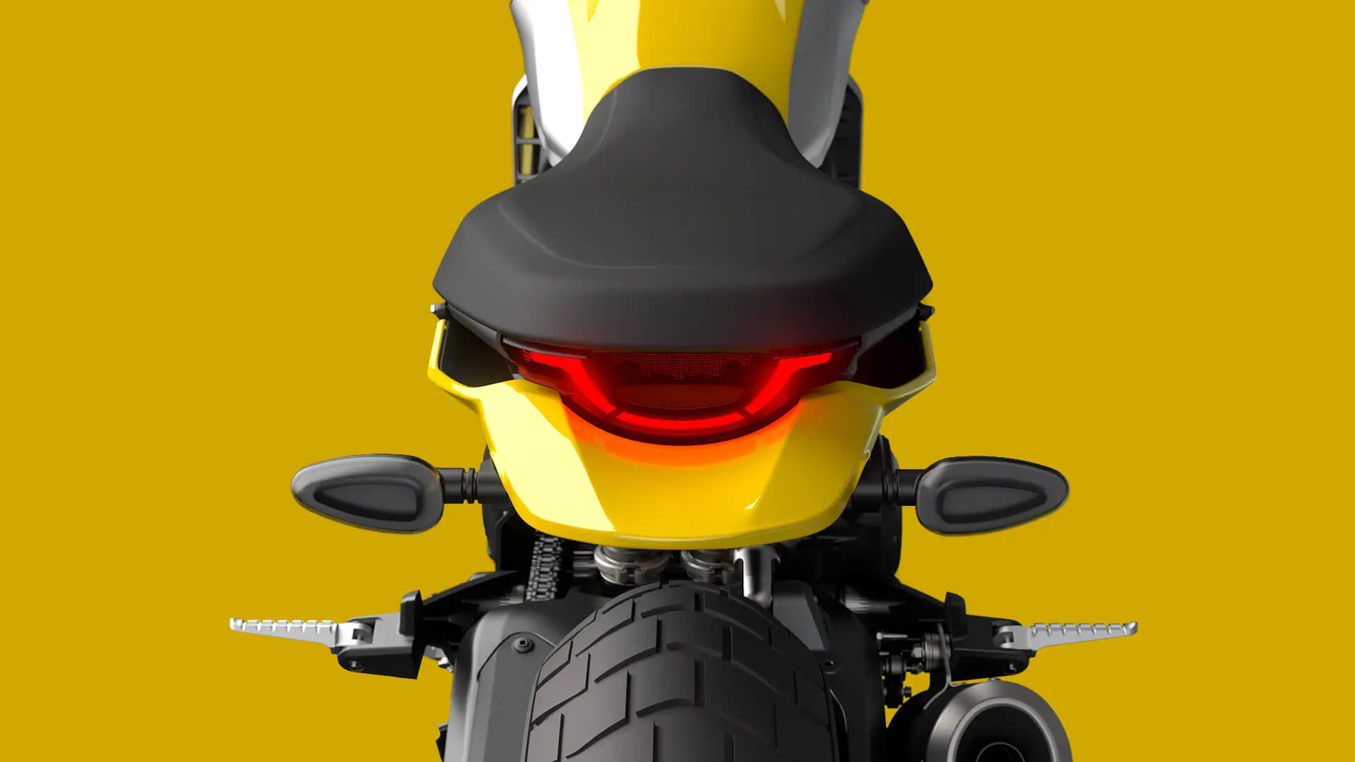 Rückansicht eines Motorrads Scrambler Icon Next Gen, mit leuchtendem Rücklicht.