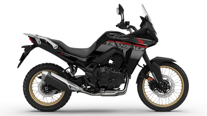 Ein schwarzes Honda Transalp Motorrad mit goldenen Felgen auf transparentem Hintergrund.